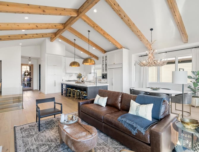 Mountain home interior with exposed wood beams and open living space
